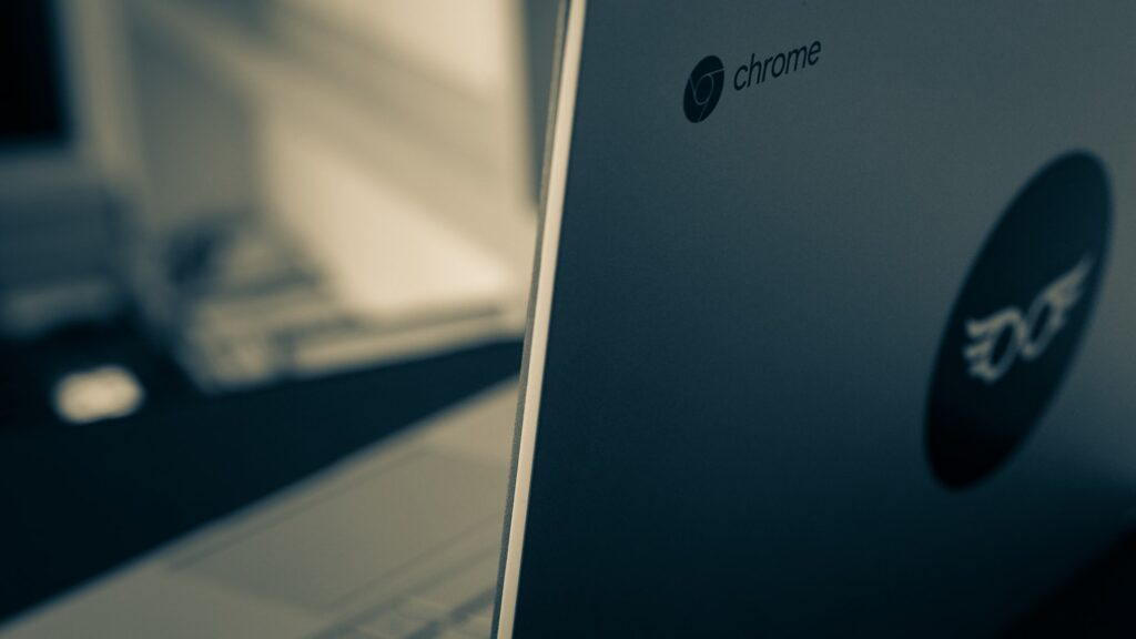 A close up on a Chromebook focusing on the Chrome logo